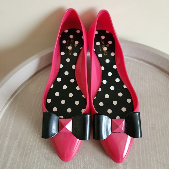 kate spade Shoes - Kate Spade Pink Flats with Black Bow Accent